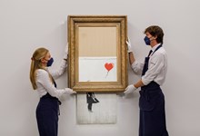 Recorda-se da obra de Banksy que se autodestruiu? Foi vendida por mais de 20 milhões de euros