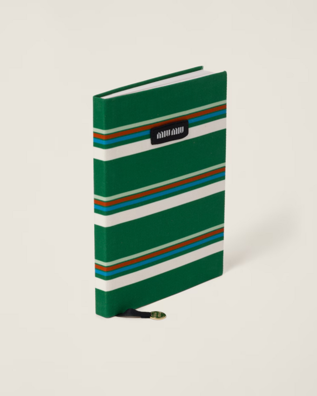 Miu Miu, Agenda revestida em tecido, €210.