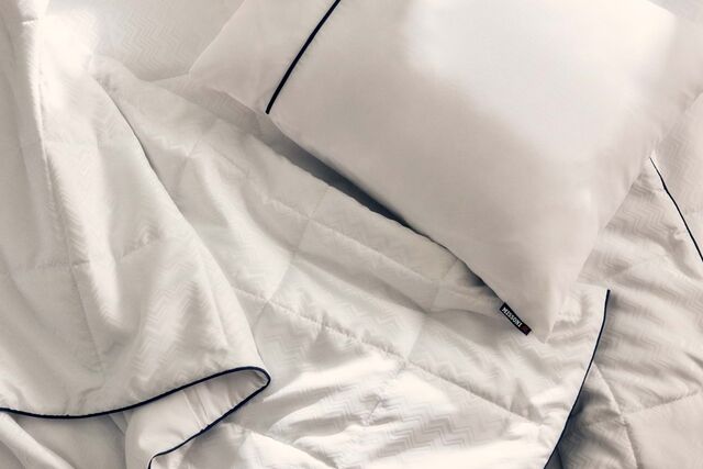 Conjunto de roupas de cama.
